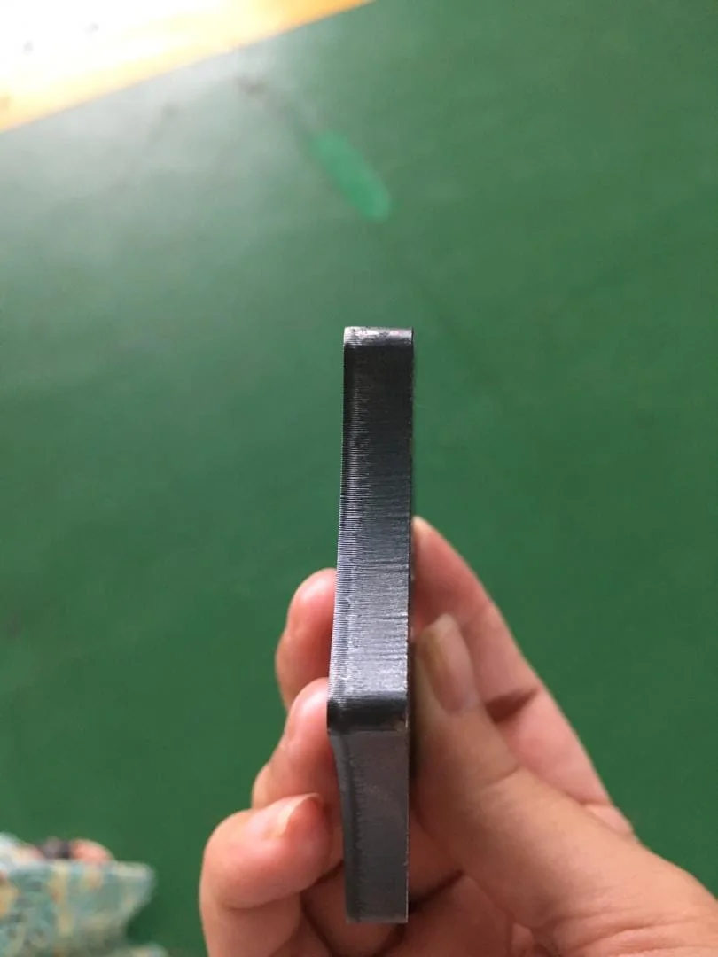 Laser technology precision engineering close-up showing fine detail work on metal component